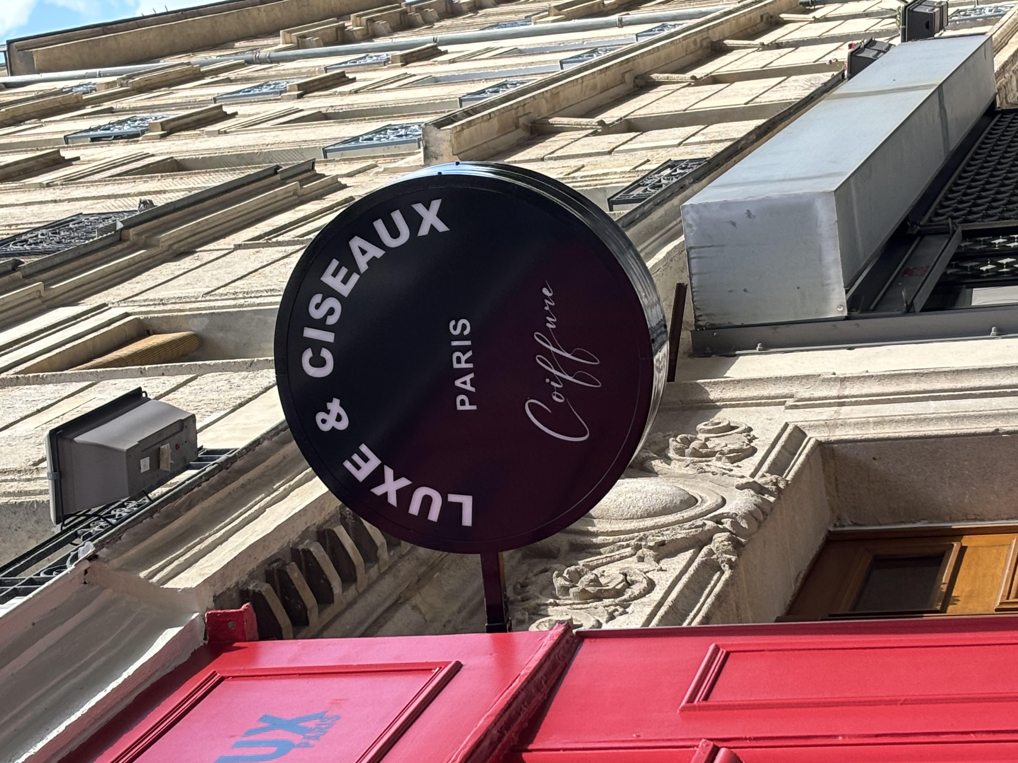 Enseigne en drapeau caisson rond