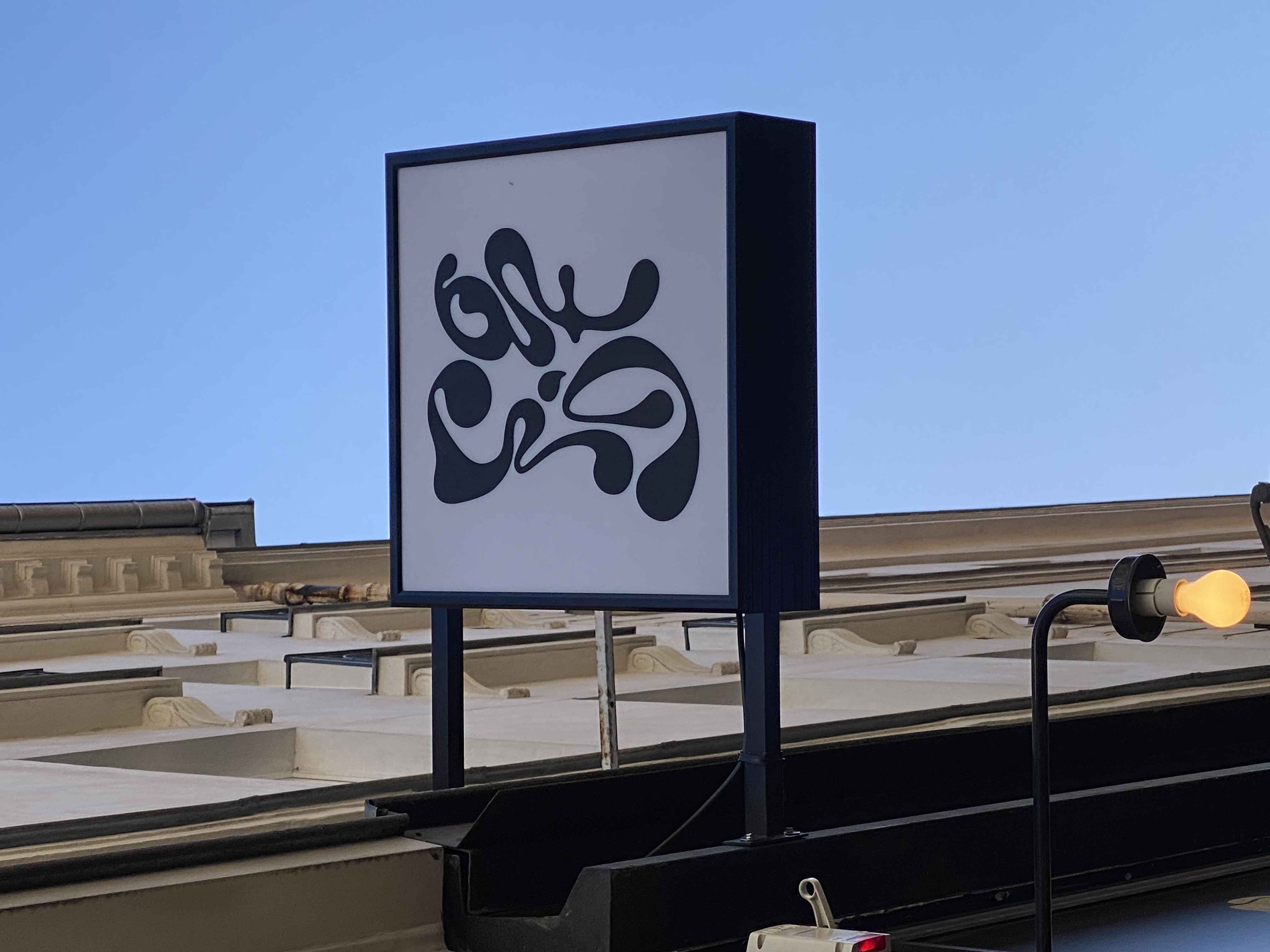 Enseigne drapeau lumineuse